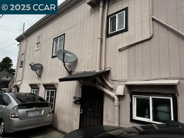 a view of a house with a car park side of it