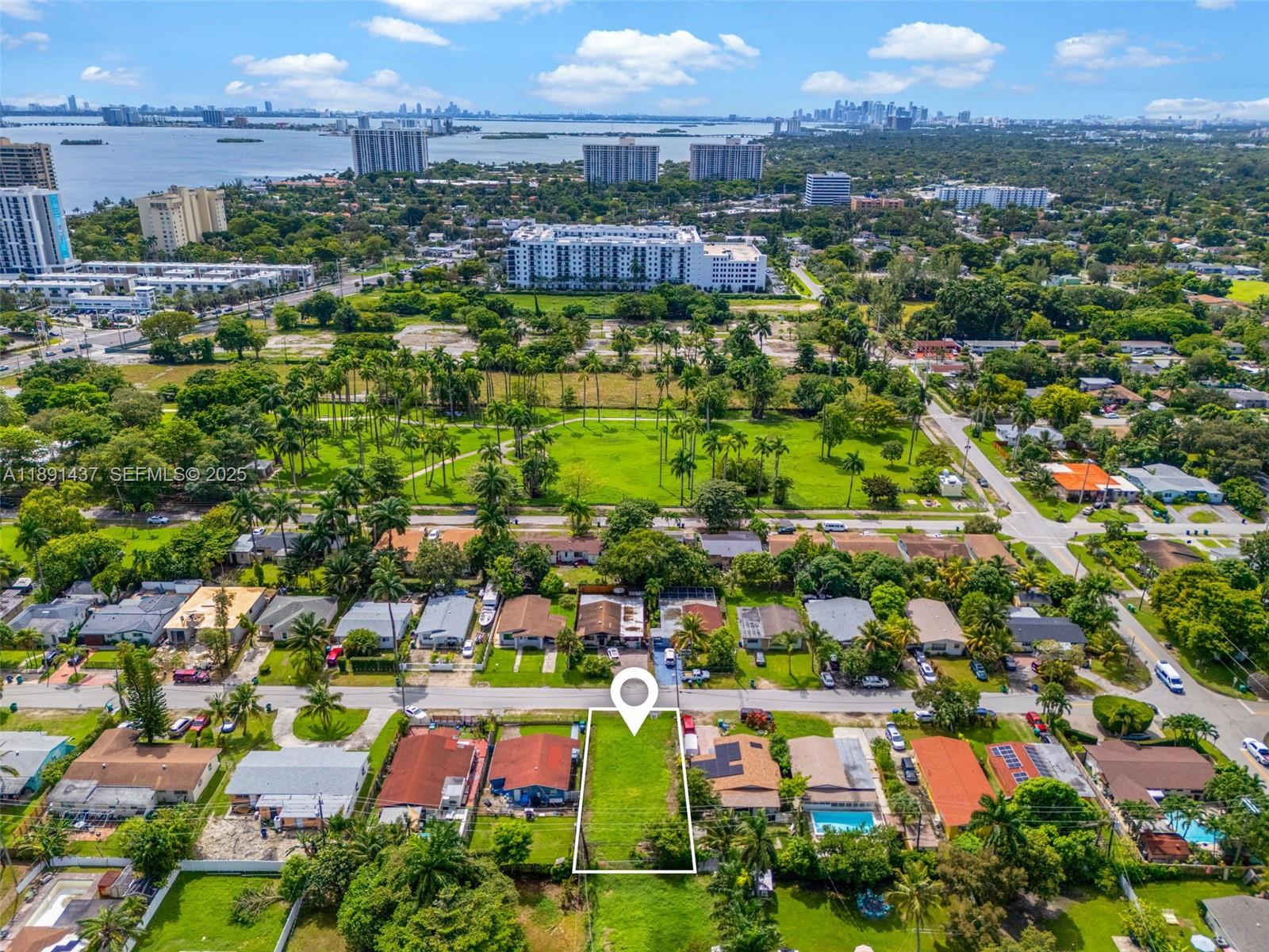 1453 Northeast 117th Street Miami, FL 33161 - Photo 11 of 15 an aerial view of residential houses with outdoor space and street view