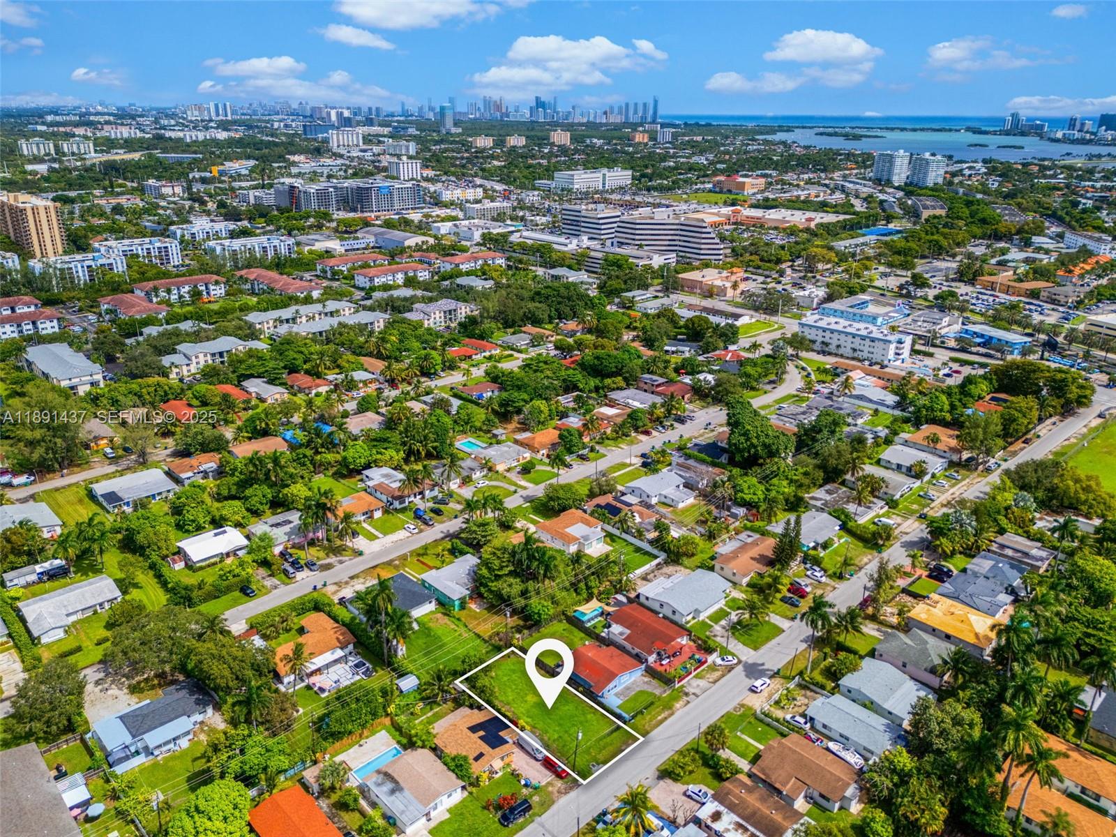 1453 Northeast 117th Street Miami, FL 33161 - Photo 14 of 15 an aerial view of residential houses with outdoor space and street view