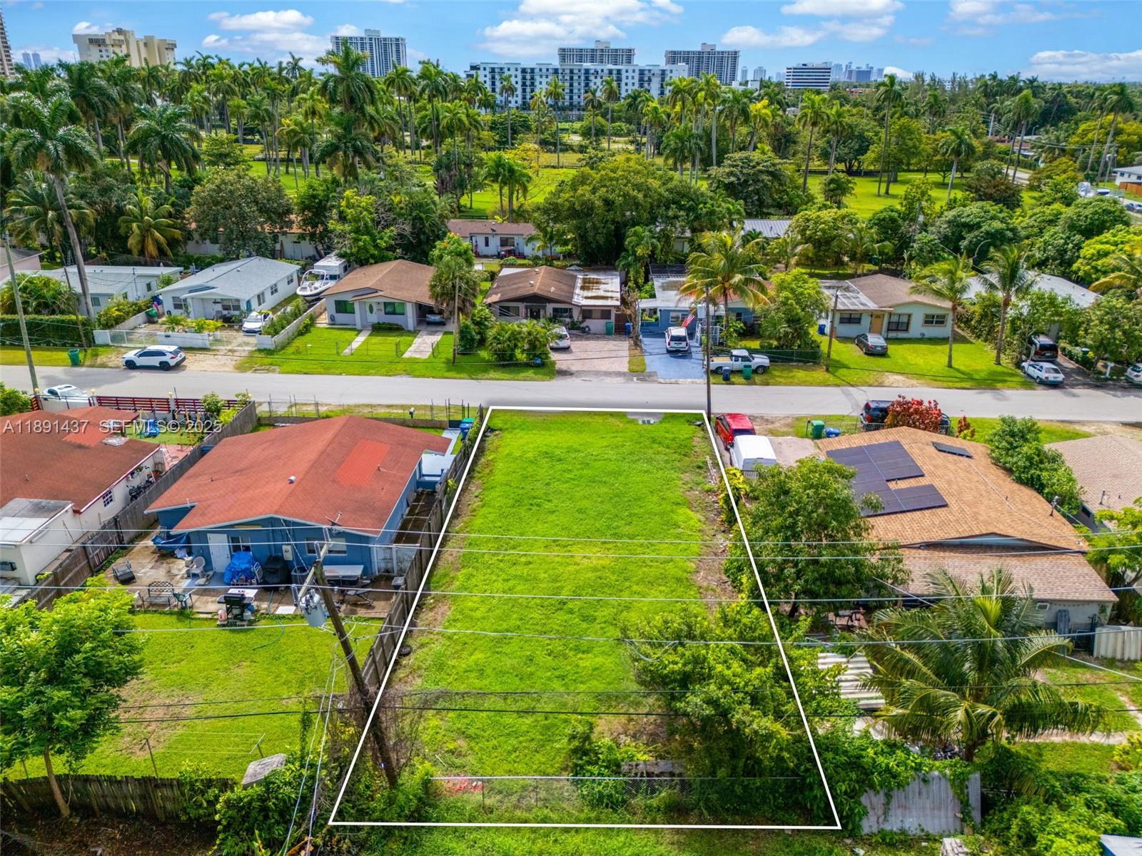 1453 Northeast 117th Street Miami, FL 33161 - Photo 5 of 15 an aerial view of a houses with a yard