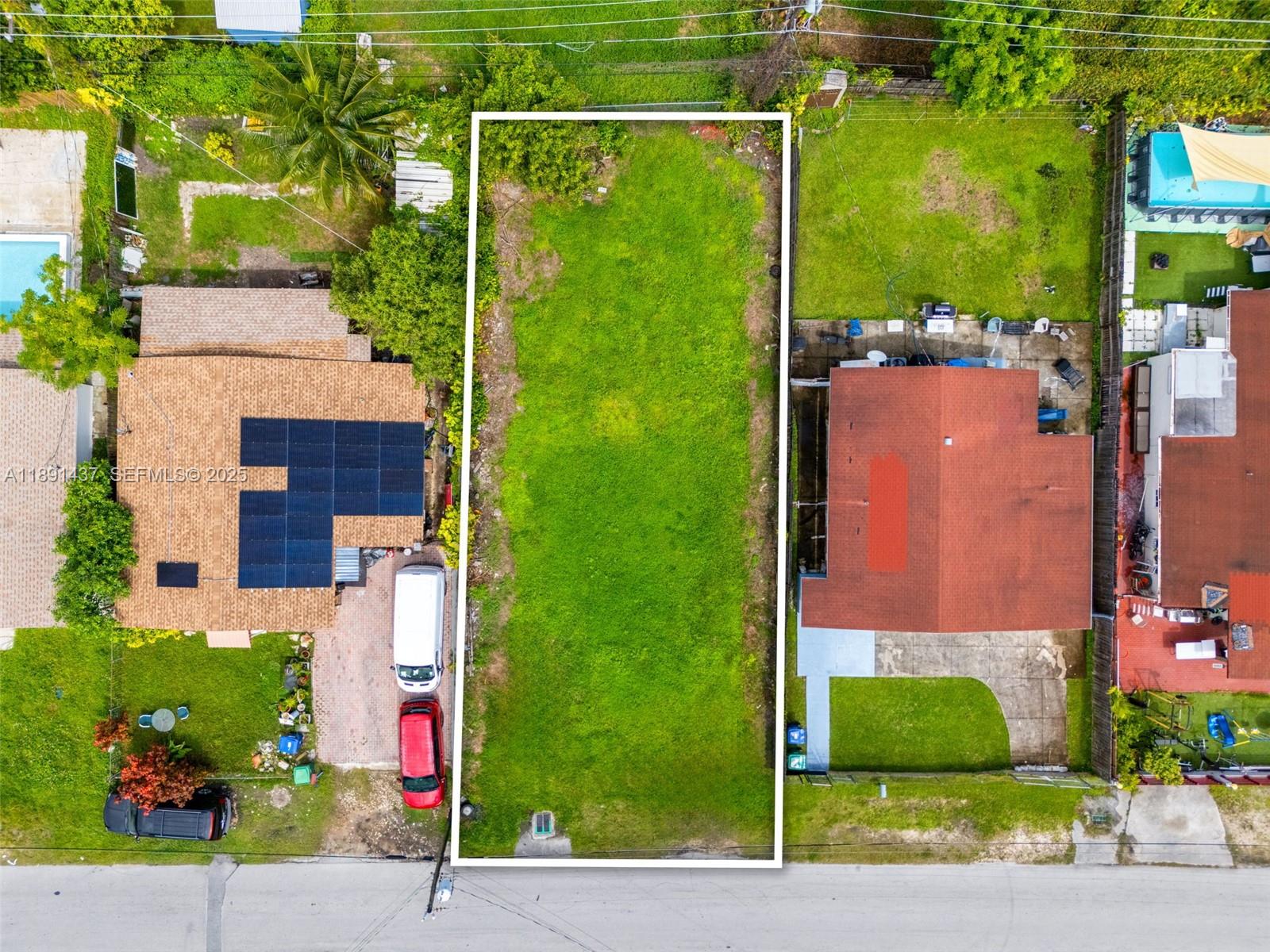 1453 Northeast 117th Street Miami, FL 33161 - Photo 7 of 15 front view of a house with a small yard