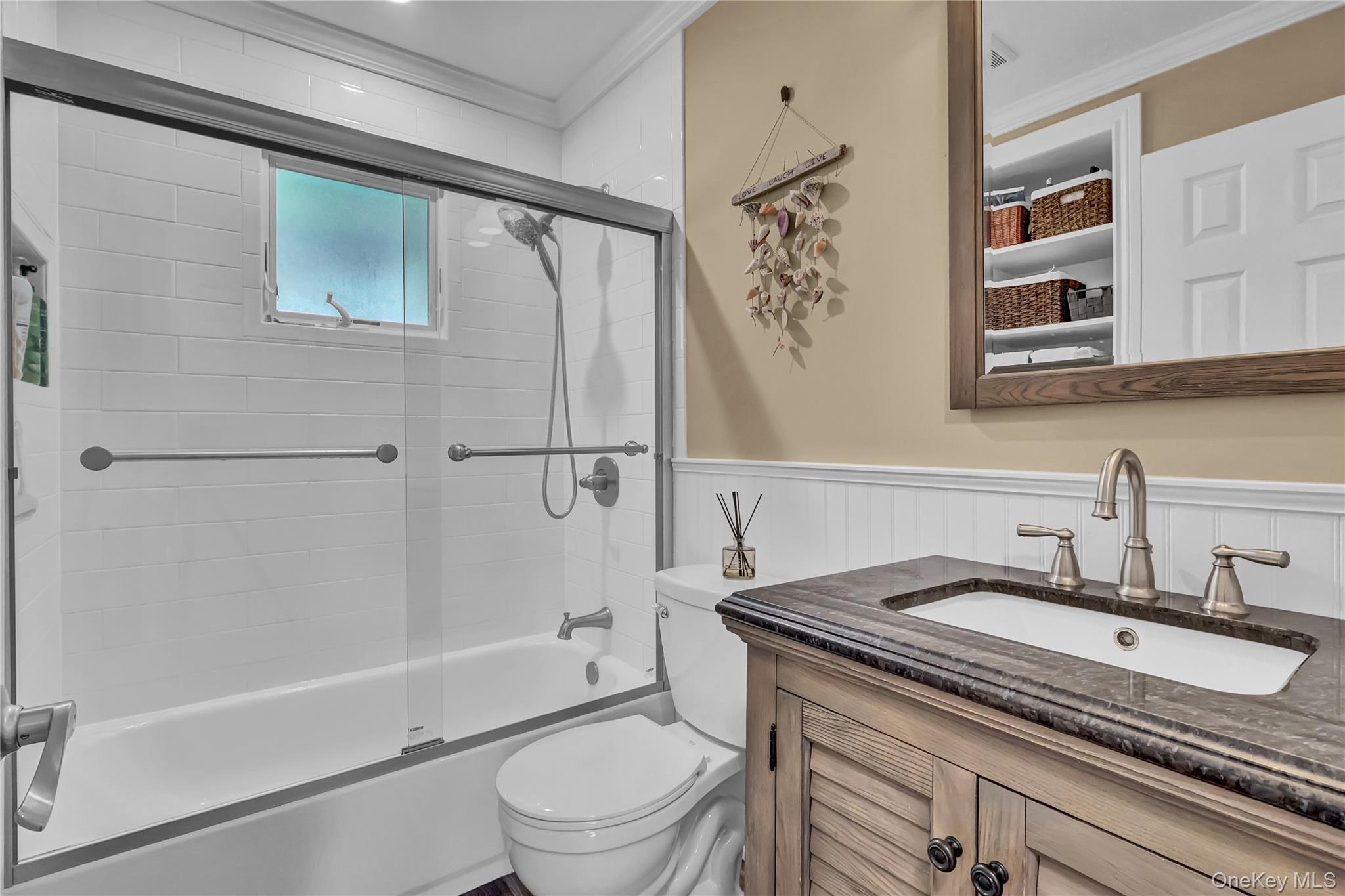 171 Prince Road Rocky Point, NY 11778 - Photo 23 of 35 Updated bath has built in shelves and a combo shower/tub