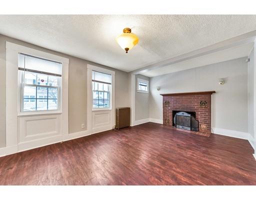 107 Cedar Street Springfield, MA 01105 - Photo 2 of 29 a view of empty room with wooden floor and fan
