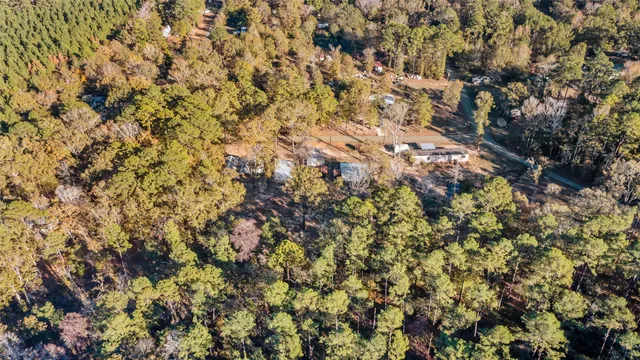 a backyard of a house with lots of trees