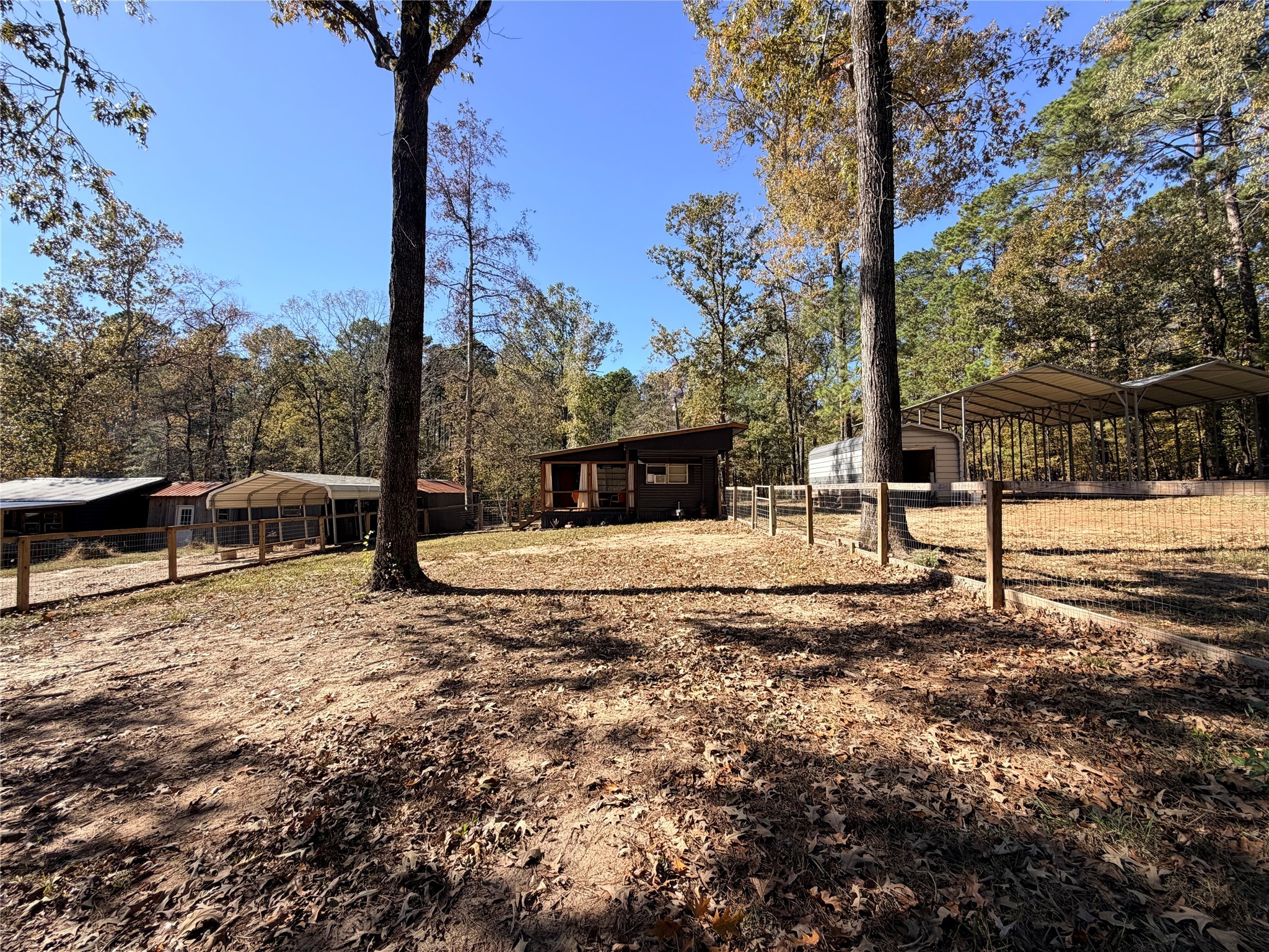 171 County Road 421 Bronson, TX 75930 - Photo 13 of 49 a view of a yard with wooden fence