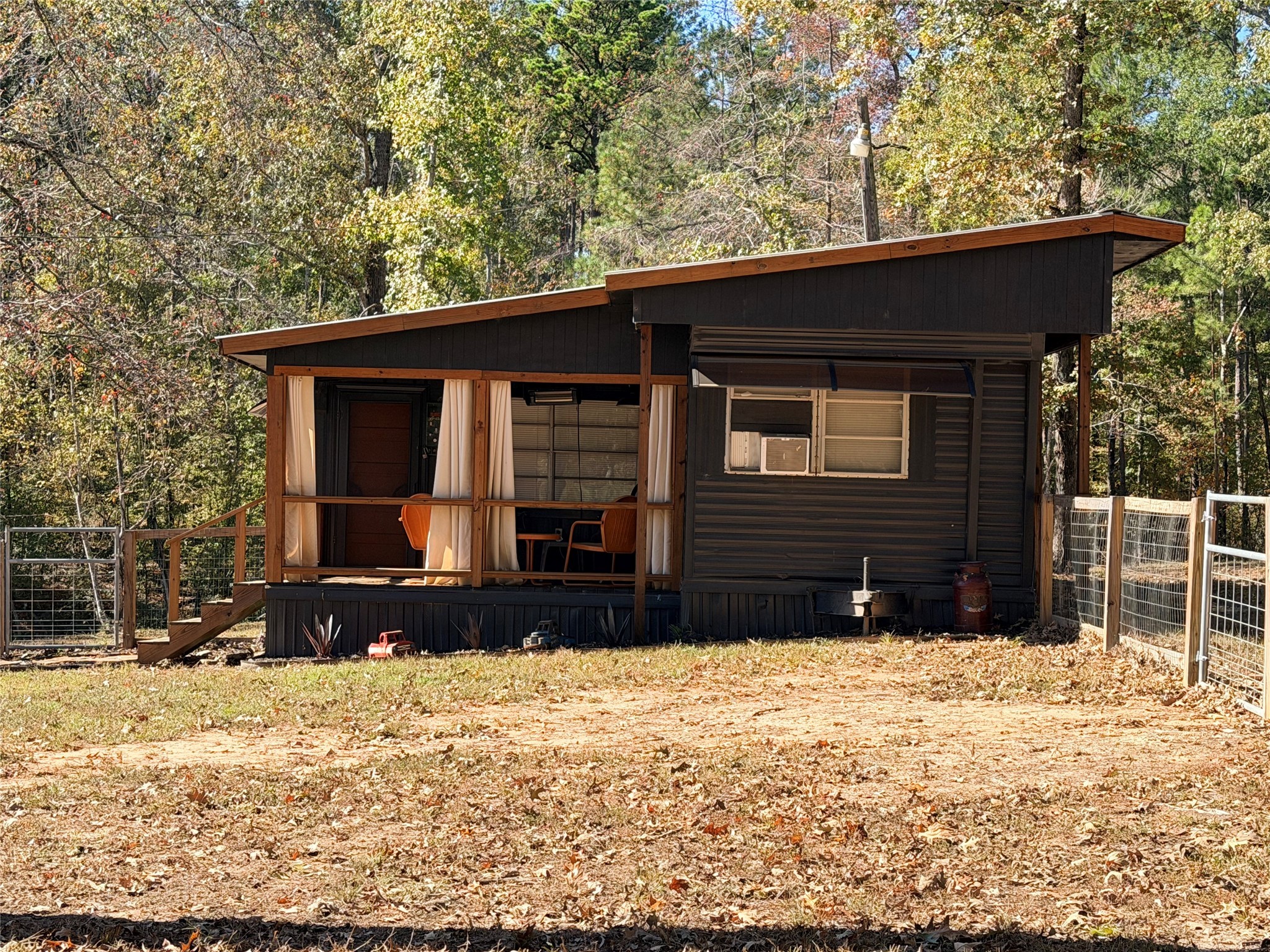 171 County Road 421 Bronson, TX 75930 - Photo 14 of 49 a front view of a house with a yard