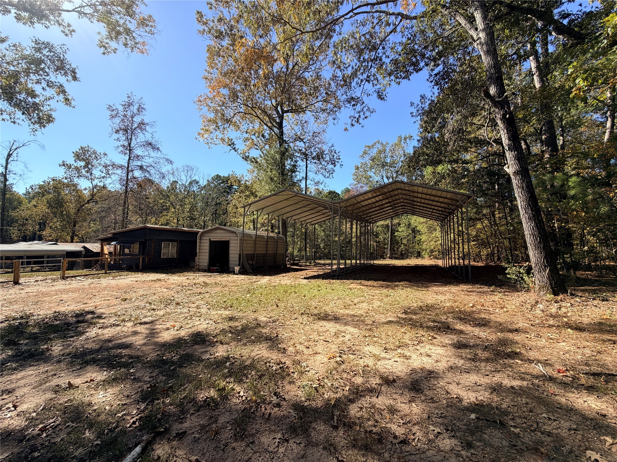 171 County Road 421 Bronson, TX 75930 - Photo 18 of 49 a house with trees in the background