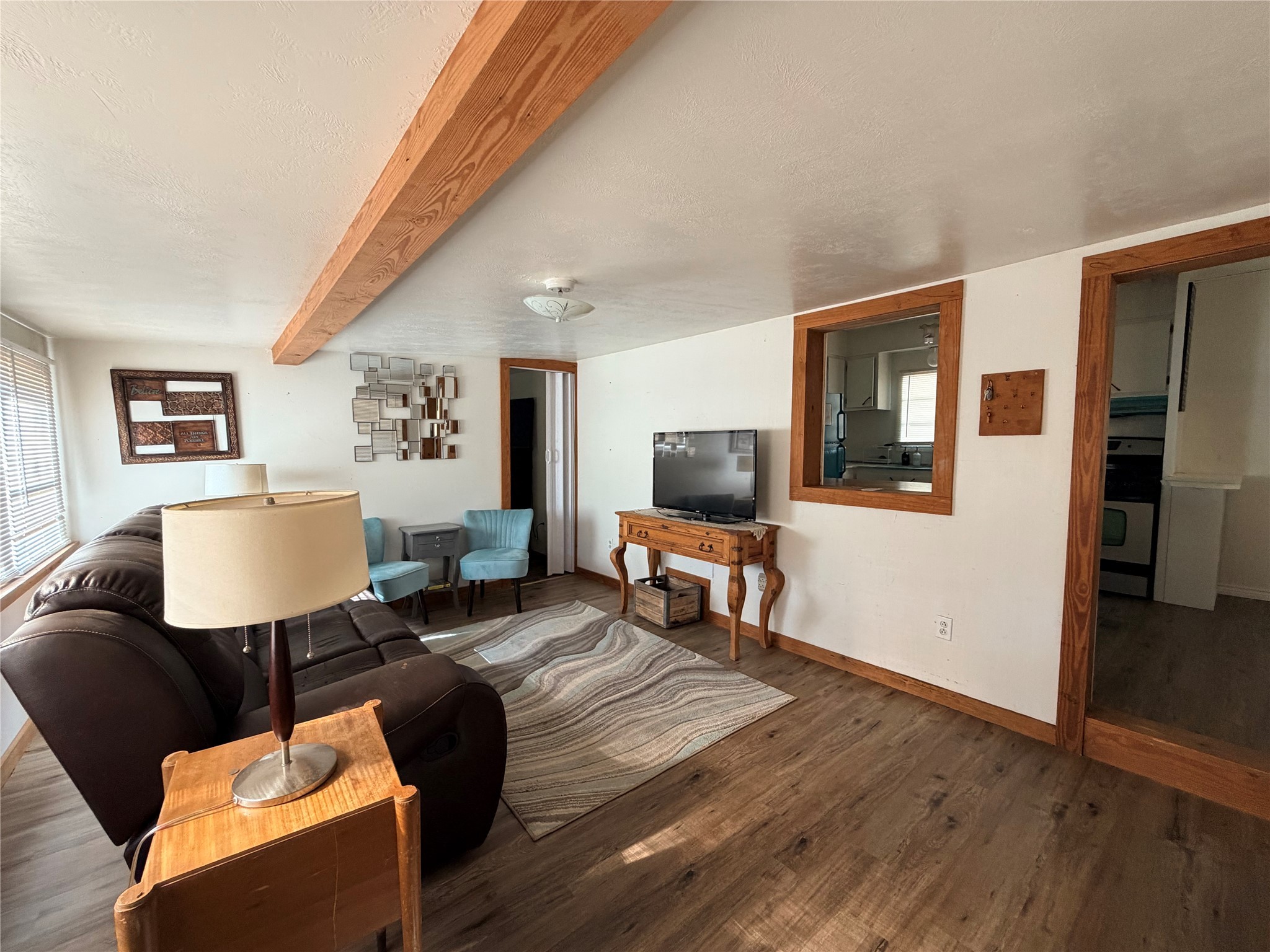 171 County Road 421 Bronson, TX 75930 - Photo 26 of 49 a living room with furniture and a flat screen tv
