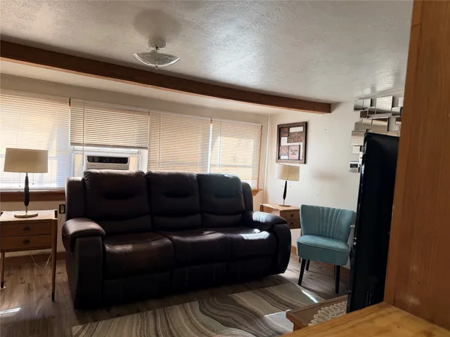 a kitchen with stainless steel appliances granite countertop a stove a refrigerator and a microwave