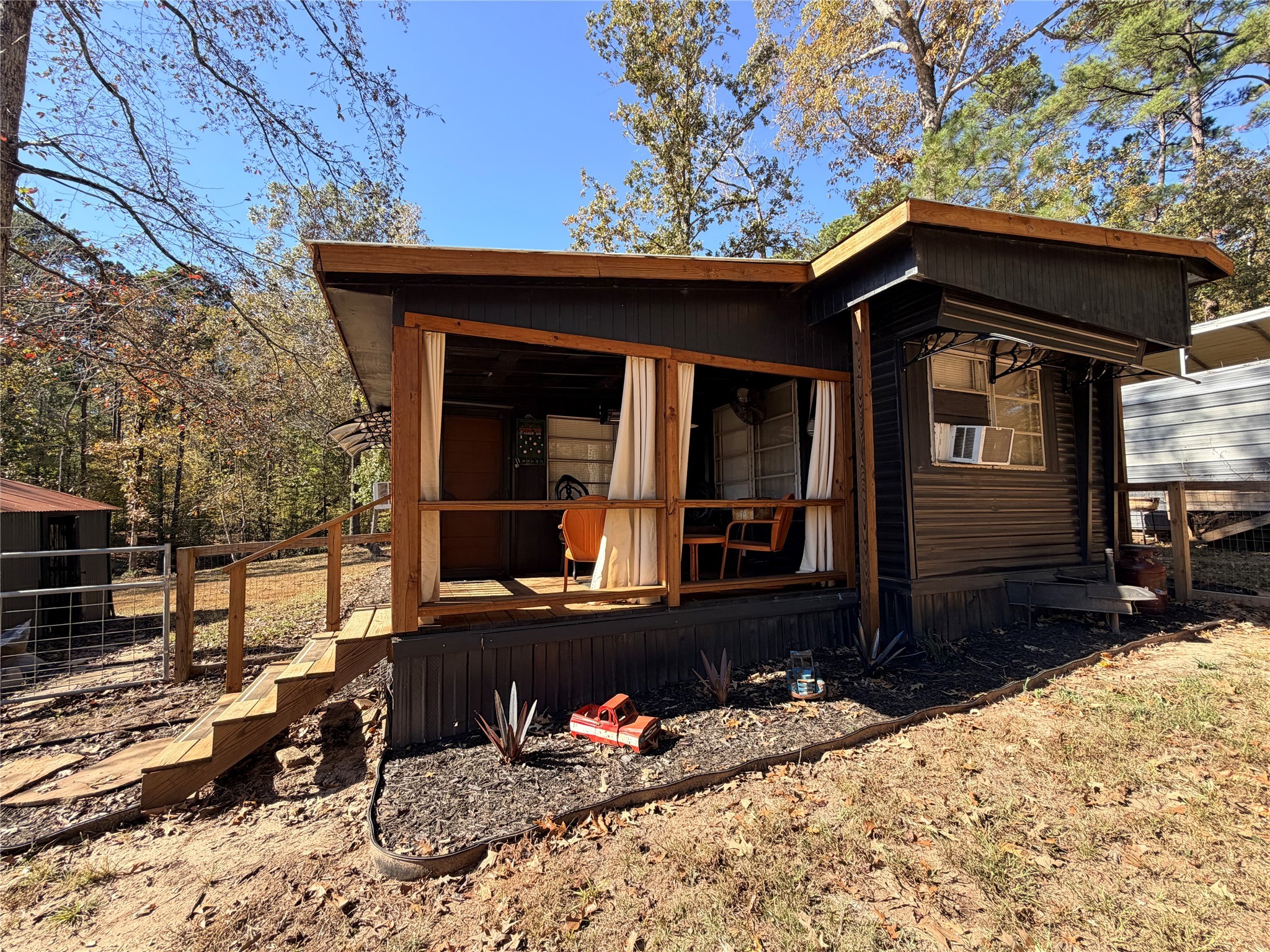 171 County Road 421 Bronson, TX 75930 - Photo 3 of 49 a front view of a house with a yard