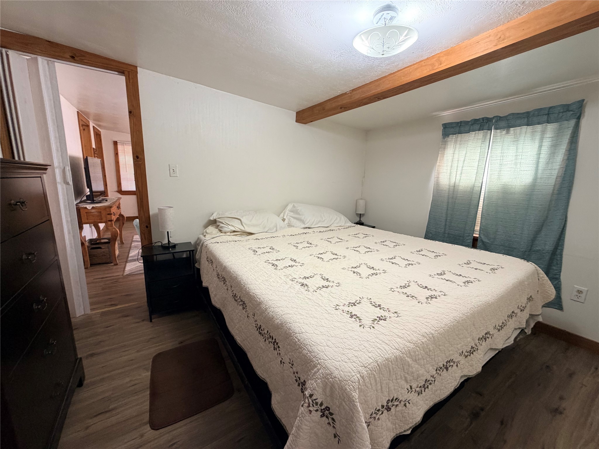 171 County Road 421 Bronson, TX 75930 - Photo 40 of 49 a bed sitting in a spacious bedroom next to a window