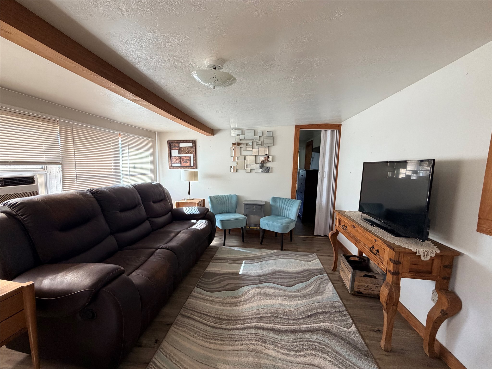 171 County Road 421 Bronson, TX 75930 - Photo 43 of 49 a living room with furniture and a flat screen tv