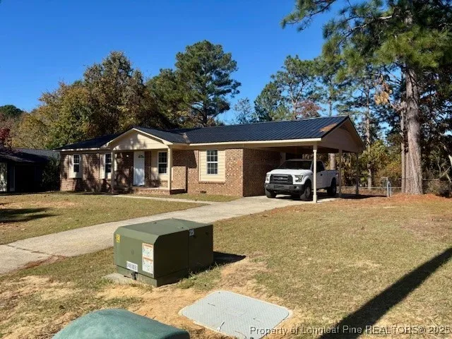 a front view of residential houses with yard