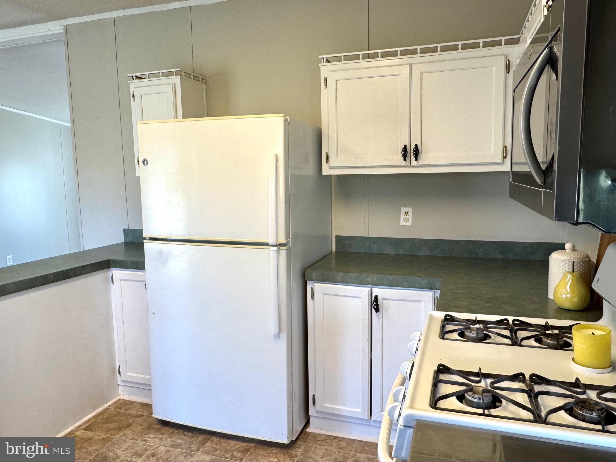 701 Cassel Road, Unit 105 Manchester, PA 17345 - Photo 12 of 35 a kitchen with a refrigerator and a stove