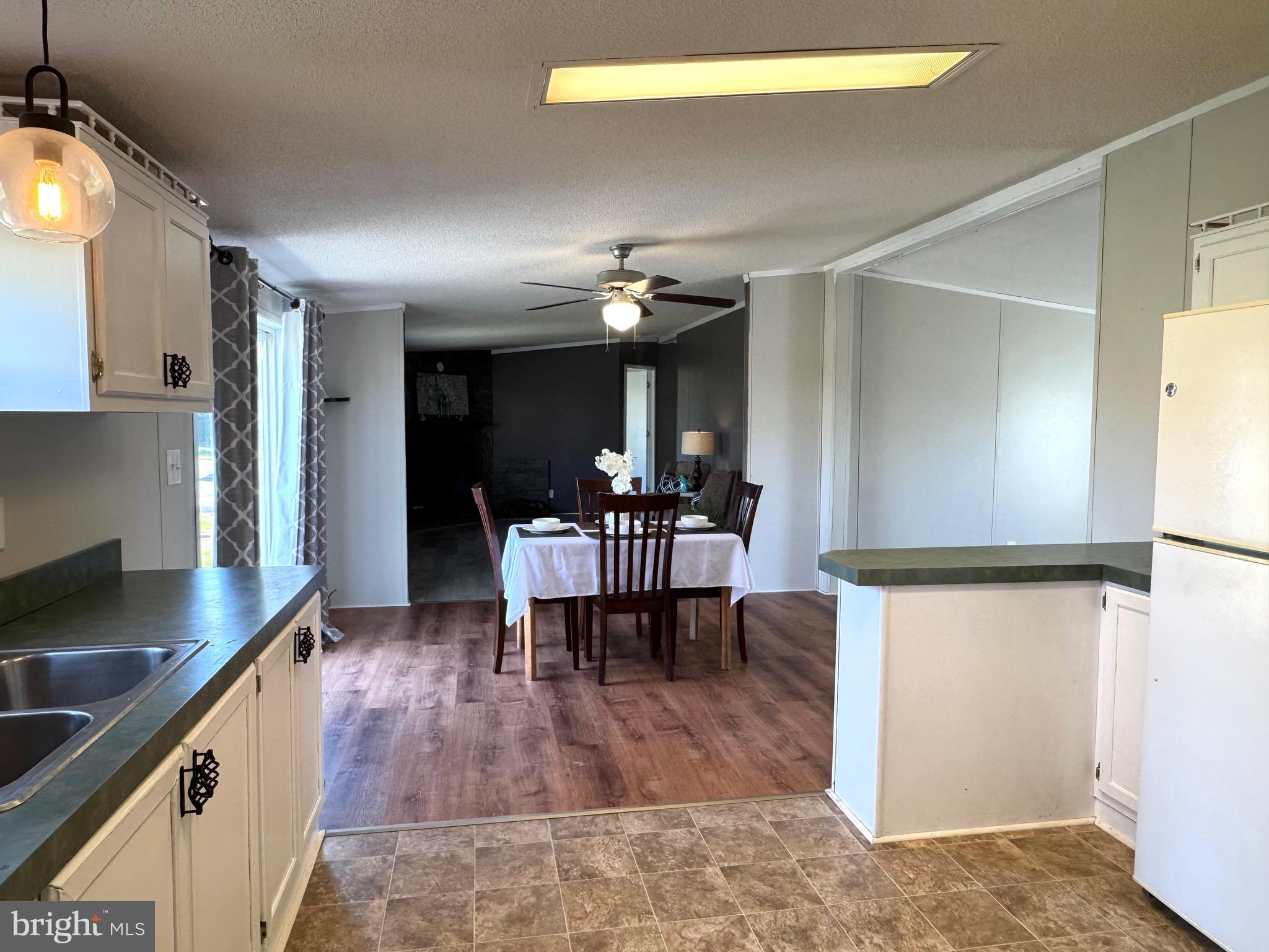 701 Cassel Road, Unit 105 Manchester, PA 17345 - Photo 15 of 35 a view of dining room with furniture and wooden floor