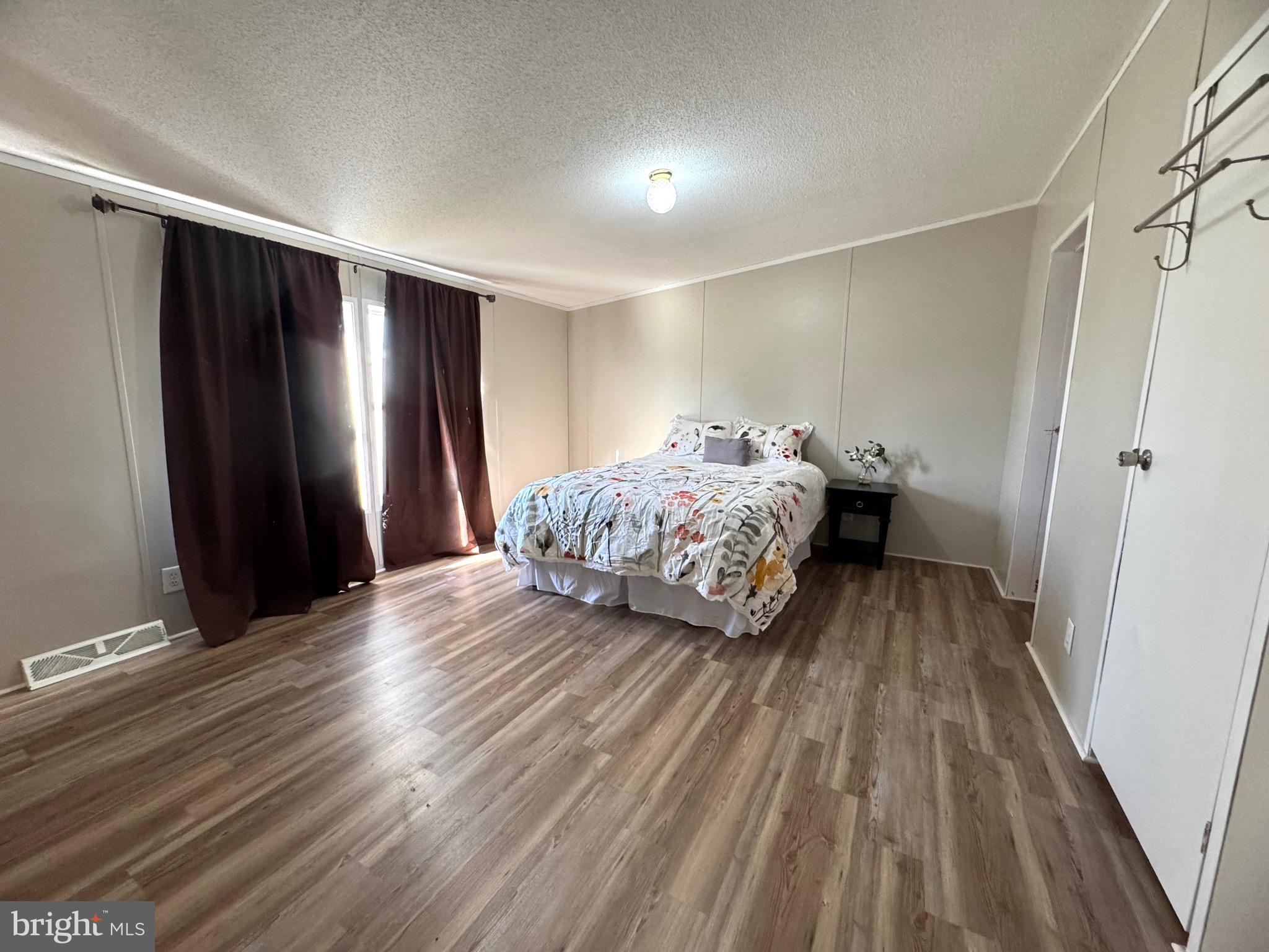 701 Cassel Road, Unit 105 Manchester, PA 17345 - Photo 19 of 35 a bedroom with a bed and a mirror