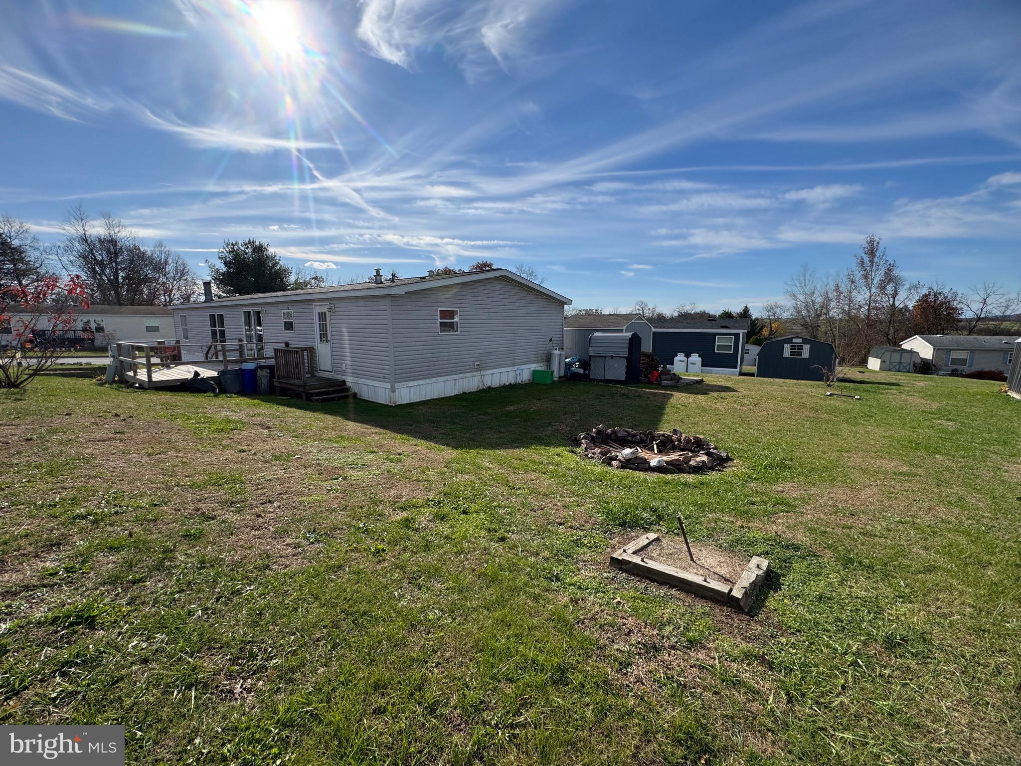 701 Cassel Road, Unit 105 Manchester, PA 17345 - Photo 31 of 35 a view of a backyard with lawn chairs and iron fence