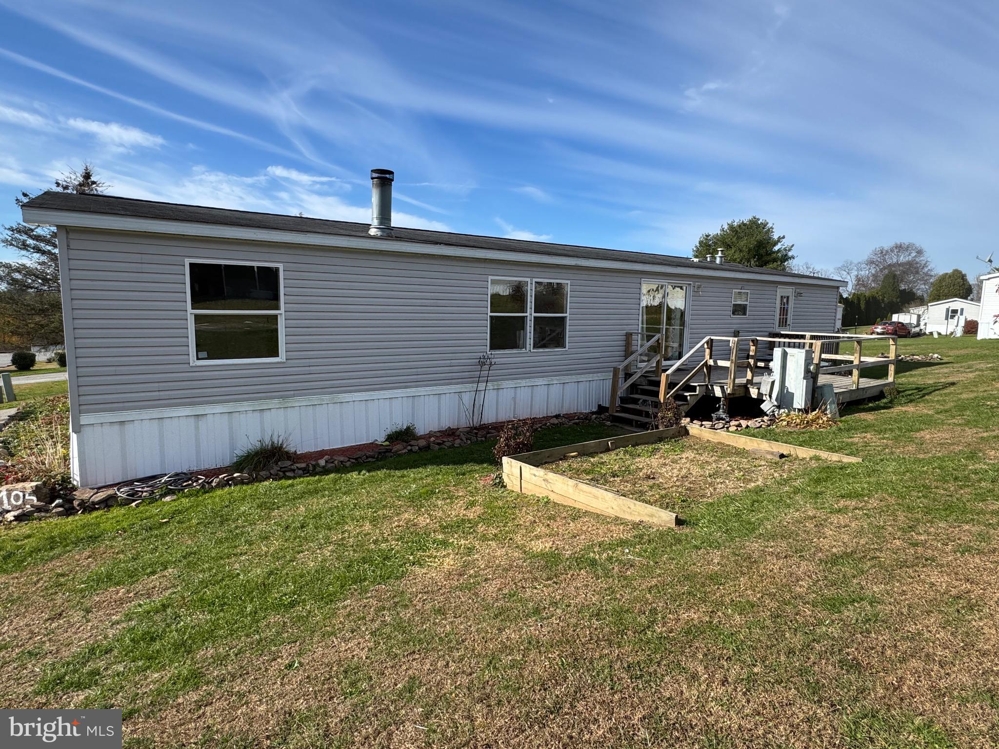 701 Cassel Road, Unit 105 Manchester, PA 17345 - Photo 4 of 35 a backyard of a house with table and chairs