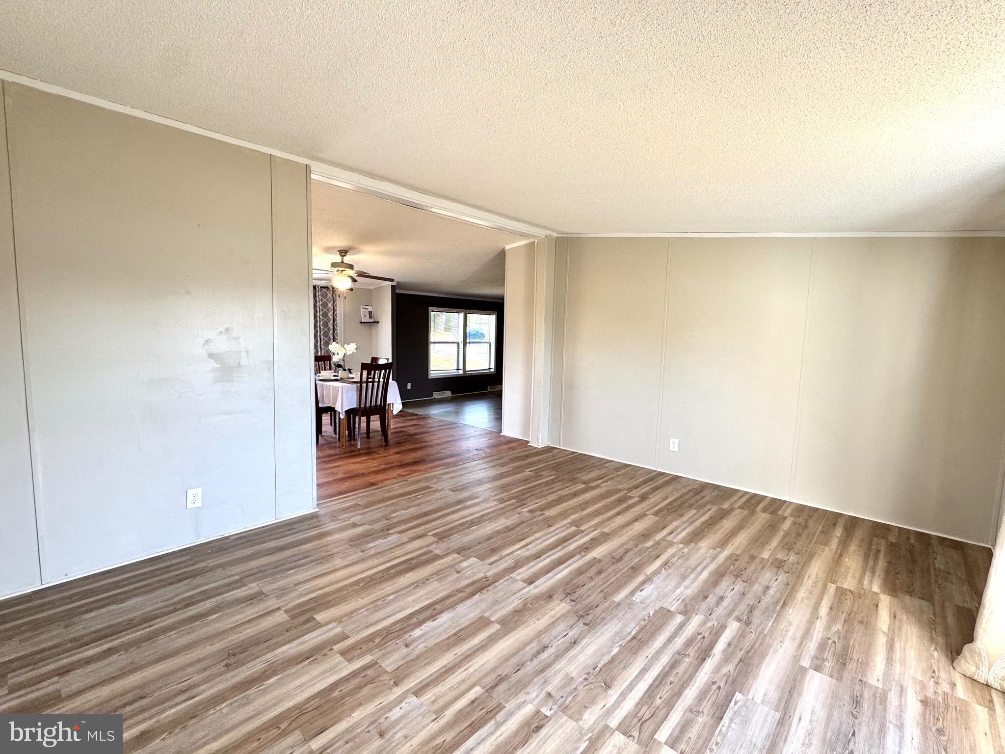 701 Cassel Road, Unit 105 Manchester, PA 17345 - Photo 7 of 35 wooden floor in an empty room with a window