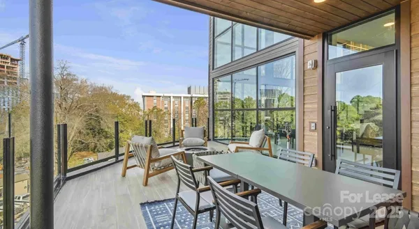 a dining room with furniture window and outside view