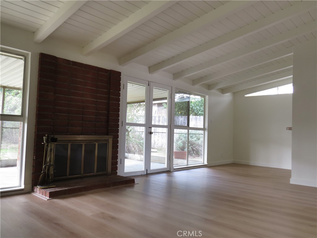 8159 Tunney Avenue Reseda, CA 91335 - Photo 11 of 33 a view of an empty room with wooden floor and a window