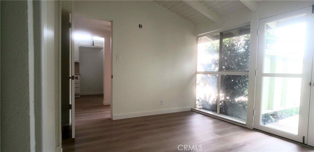 8159 Tunney Avenue Reseda, CA 91335 - Photo 17 of 33 a view of empty room with wooden floor and windows
