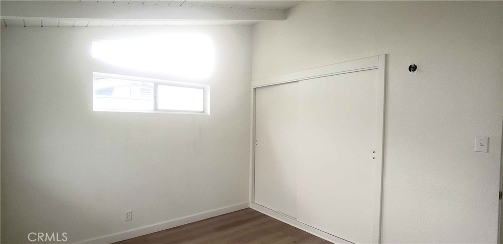 8159 Tunney Avenue Reseda, CA 91335 - Photo 22 of 33 a view of a small space with wooden floor and a window