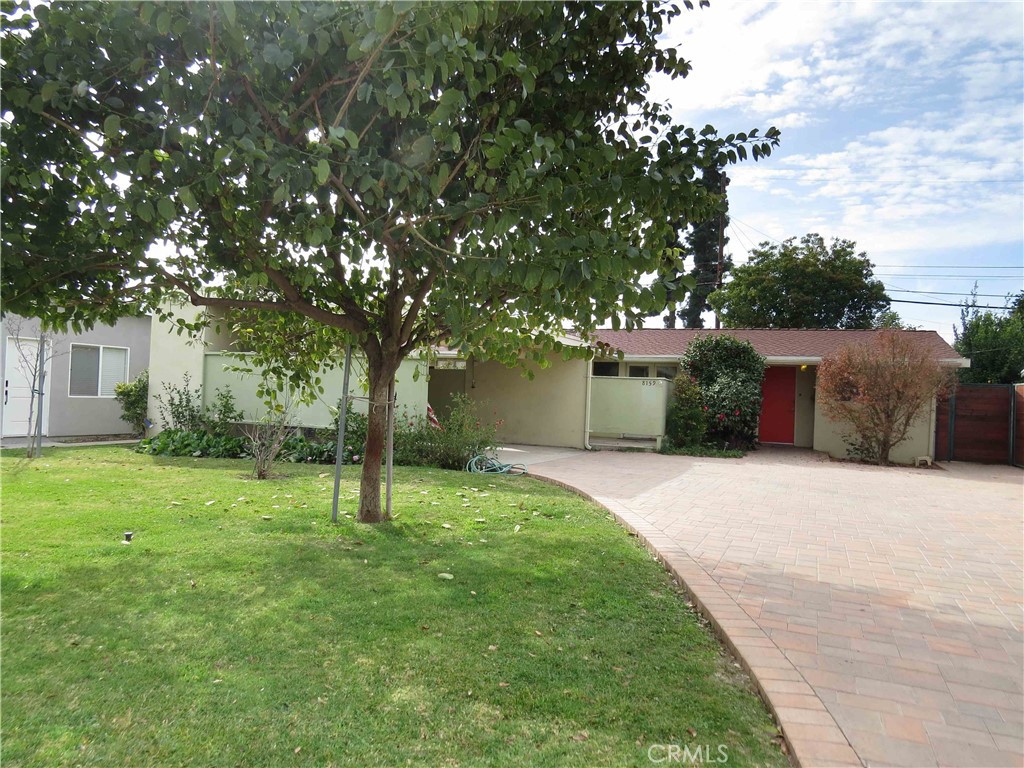 8159 Tunney Avenue Reseda, CA 91335 - Photo 3 of 33 a house is sitting in middle od the grass