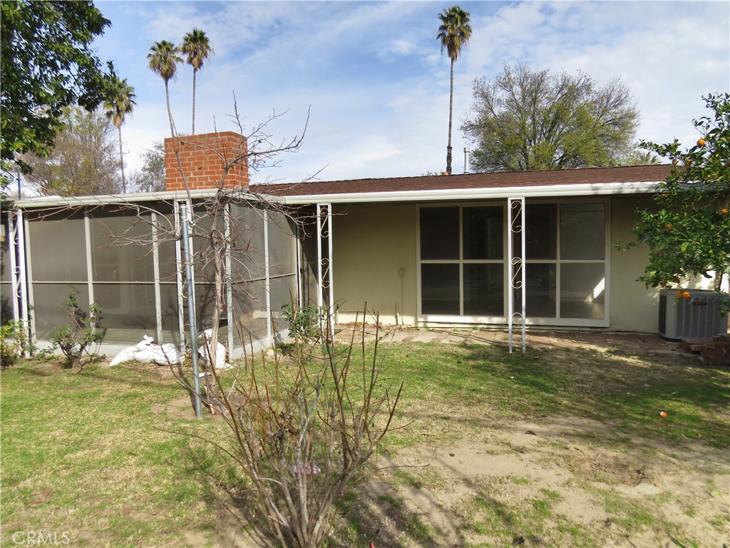 8159 Tunney Avenue Reseda, CA 91335 - Photo 32 of 33 a front view of a house with a yard and garage