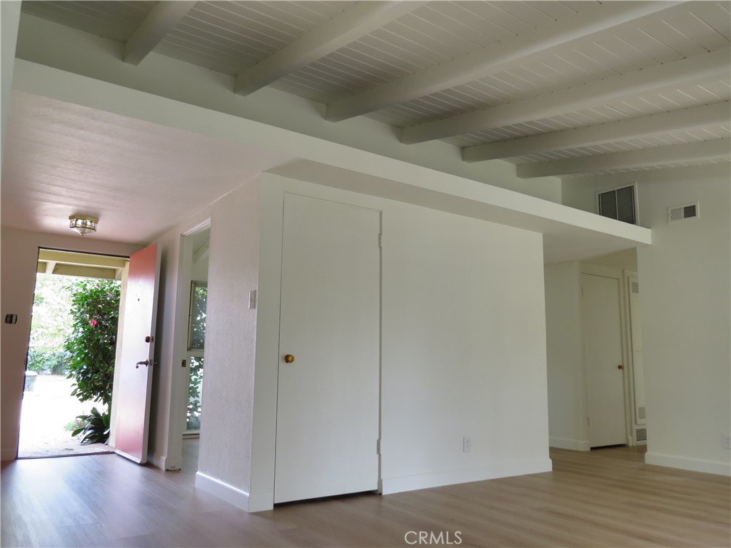 8159 Tunney Avenue Reseda, CA 91335 - Photo 7 of 33 an empty room with wooden floor windows and entrance