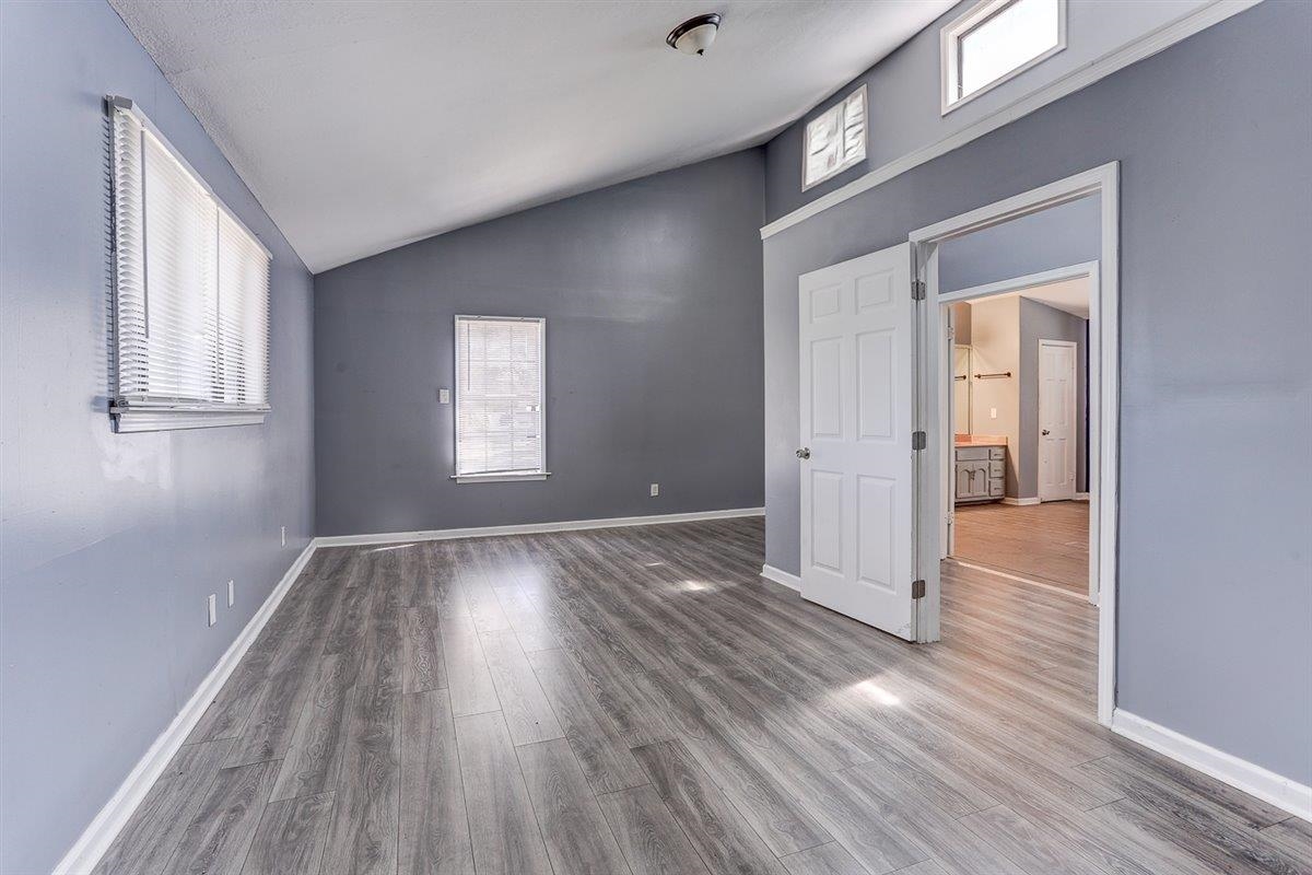 3700 Lakeview Road Memphis, TN 38116 - Photo 36 of 40 Unfurnished bedroom with wood finished floors and high vaulted ceiling