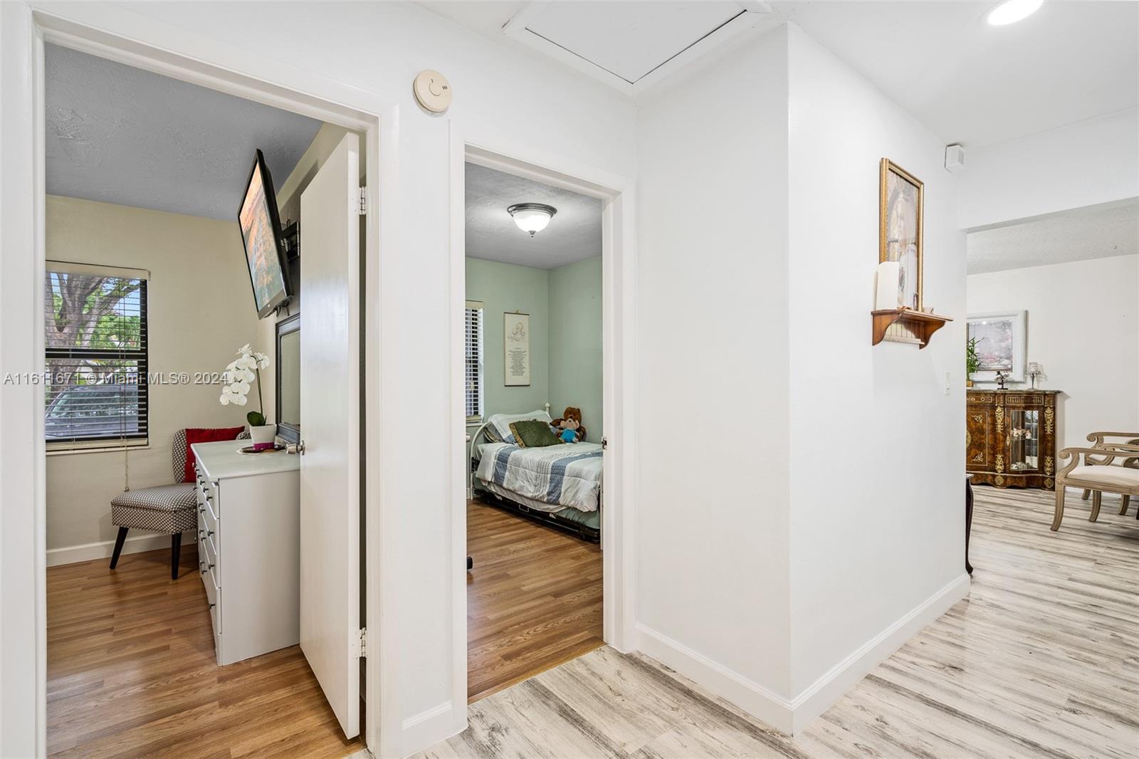 11914 Southwest 125th Place Miami, FL 33186 - Photo 20 of 31 a view of a hallway view with wooden floor and living room