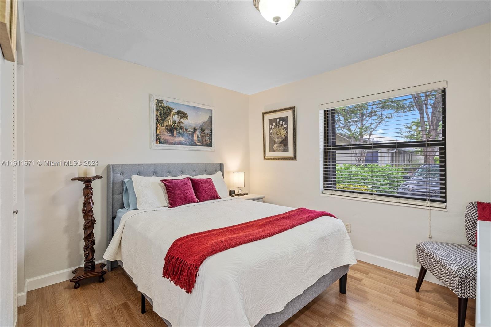 11914 Southwest 125th Place Miami, FL 33186 - Photo 23 of 31 a bedroom with bed and a window