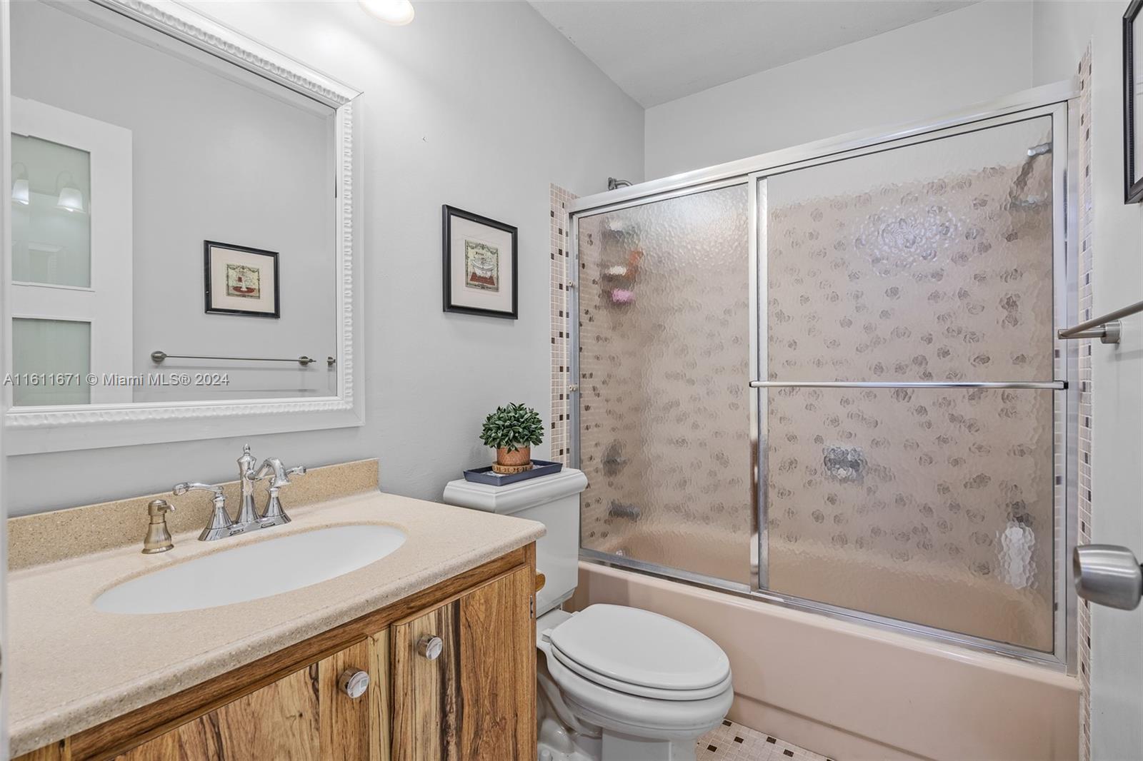 11914 Southwest 125th Place Miami, FL 33186 - Photo 25 of 31 a bathroom with a granite countertop sink toilet and shower