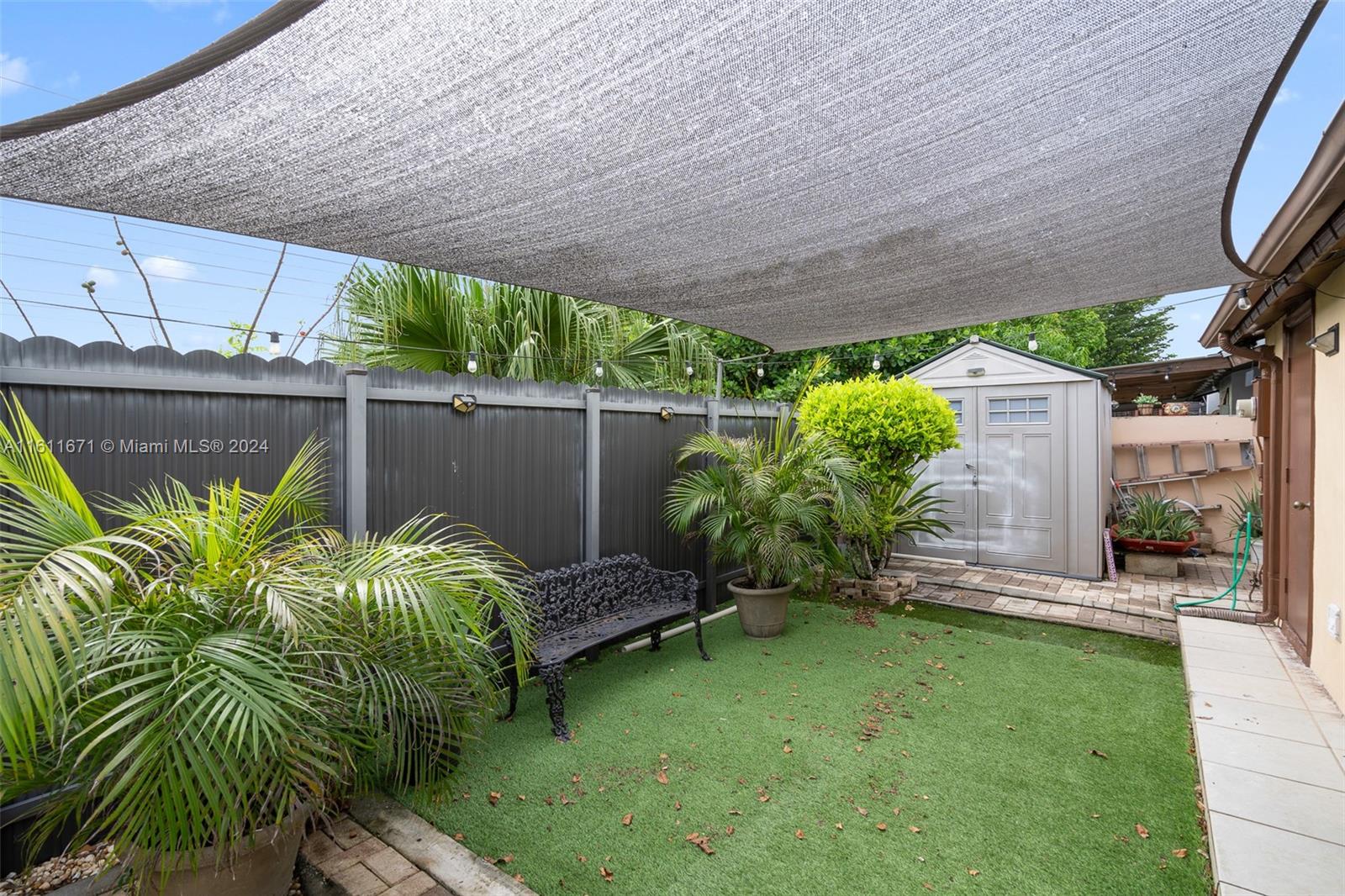 11914 Southwest 125th Place Miami, FL 33186 - Photo 26 of 31 a backyard of a house with lots of green space