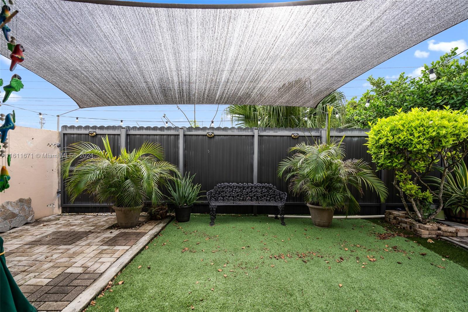 11914 Southwest 125th Place Miami, FL 33186 - Photo 28 of 31 a view of a backyard with plants and a patio