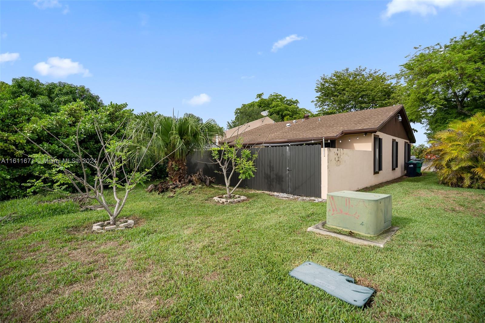 11914 Southwest 125th Place Miami, FL 33186 - Photo 31 of 31 a view of a house with a yard and tree s