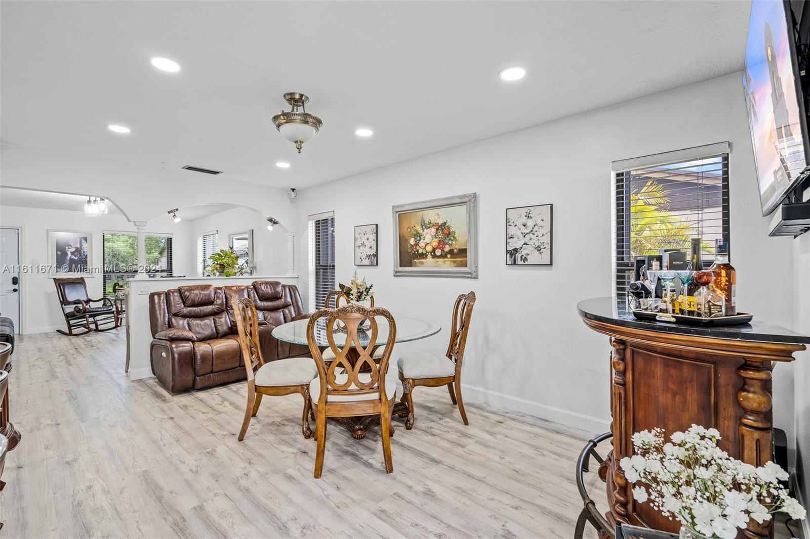 11914 Southwest 125th Place Miami, FL 33186 - Photo 8 of 31 a view of a dining room with furniture and wooden floor