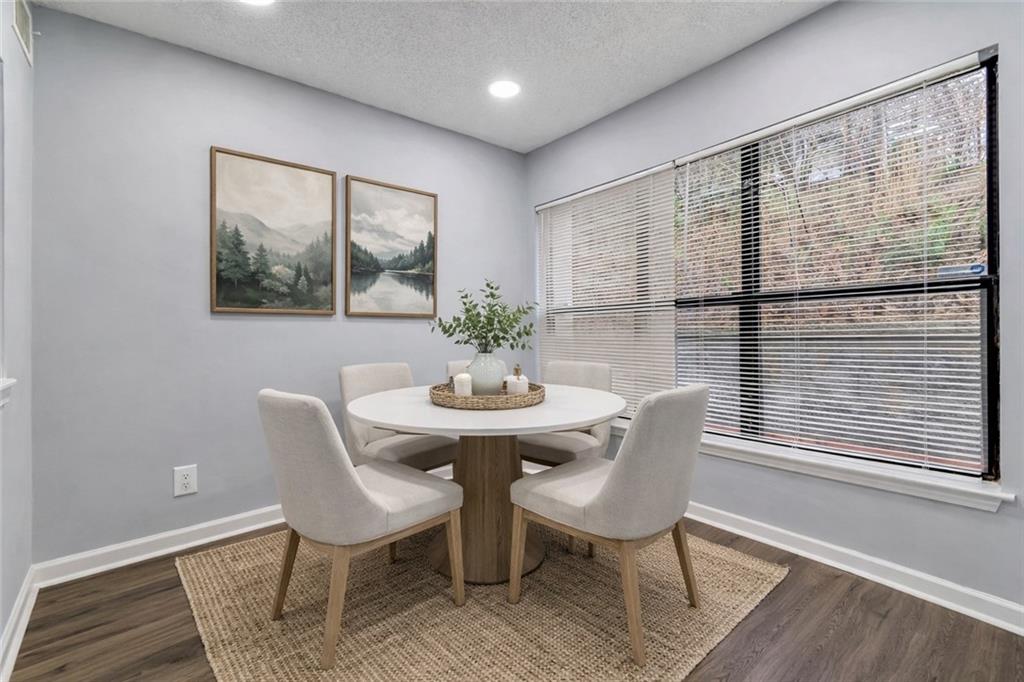 1502 Huntingdon Chase Atlanta, GA 30350 - Photo 12 of 29 a view of a dining room with furniture window and wooden floor