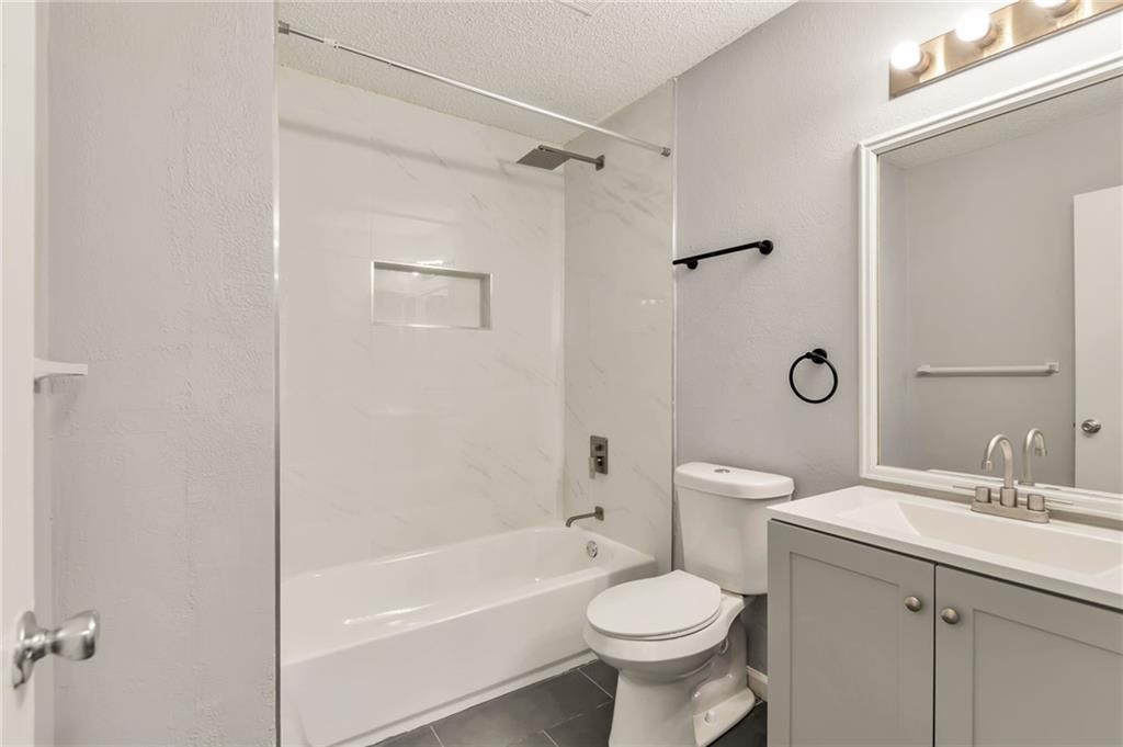 1502 Huntingdon Chase Atlanta, GA 30350 - Photo 17 of 29 a bathroom with a sink toilet and shower