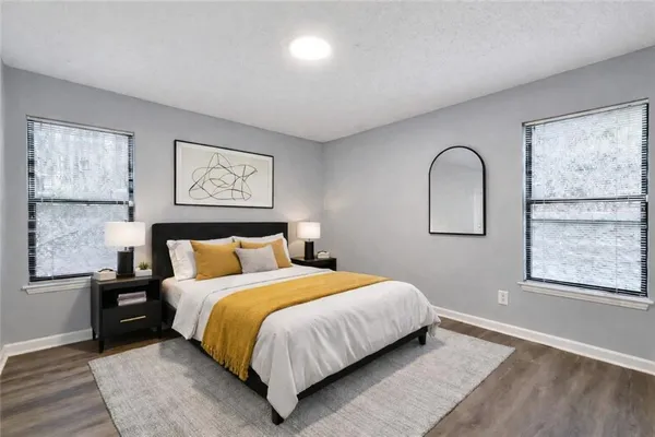 a bedroom with a bed and window