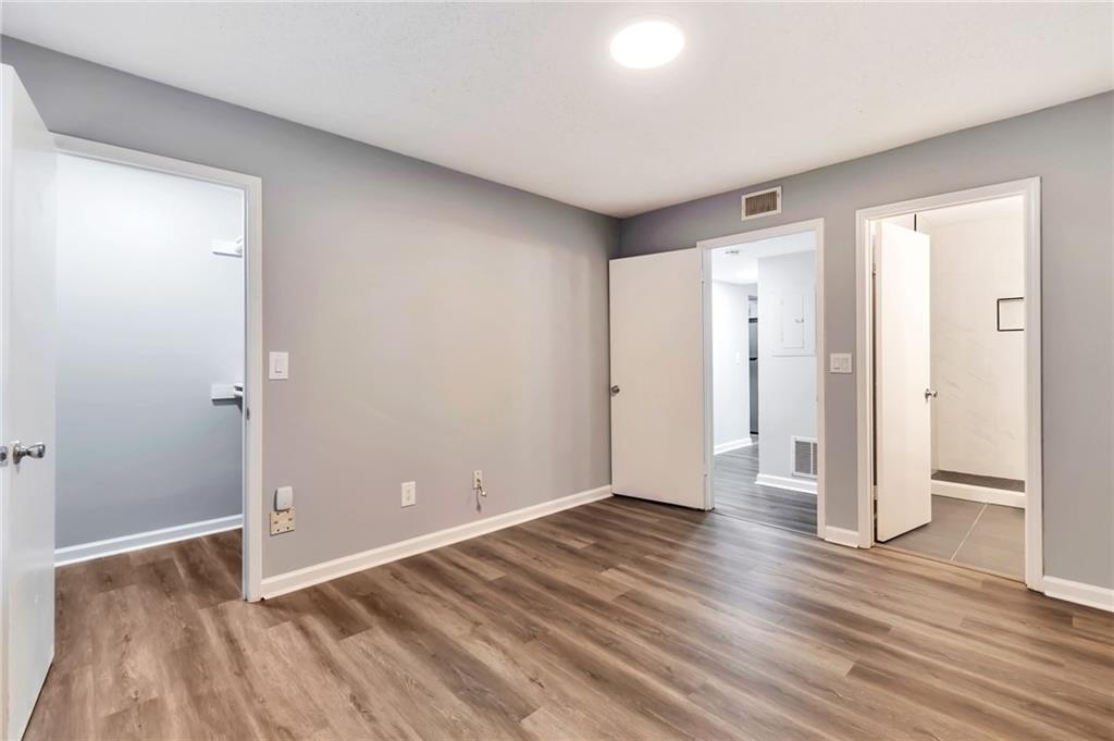 1502 Huntingdon Chase Atlanta, GA 30350 - Photo 20 of 29 a view of wooden floor and windows in a room