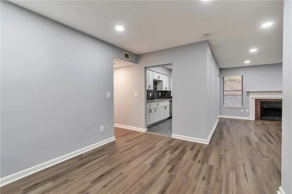 a view of kitchen and wooden floor