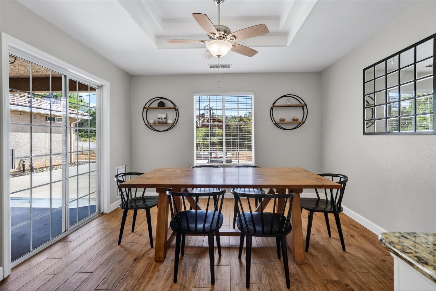 47482 Veater Ranch Road Coarsegold, CA 93614 - Photo 17 of 51 a view of a dining room with furniture window and wooden floor