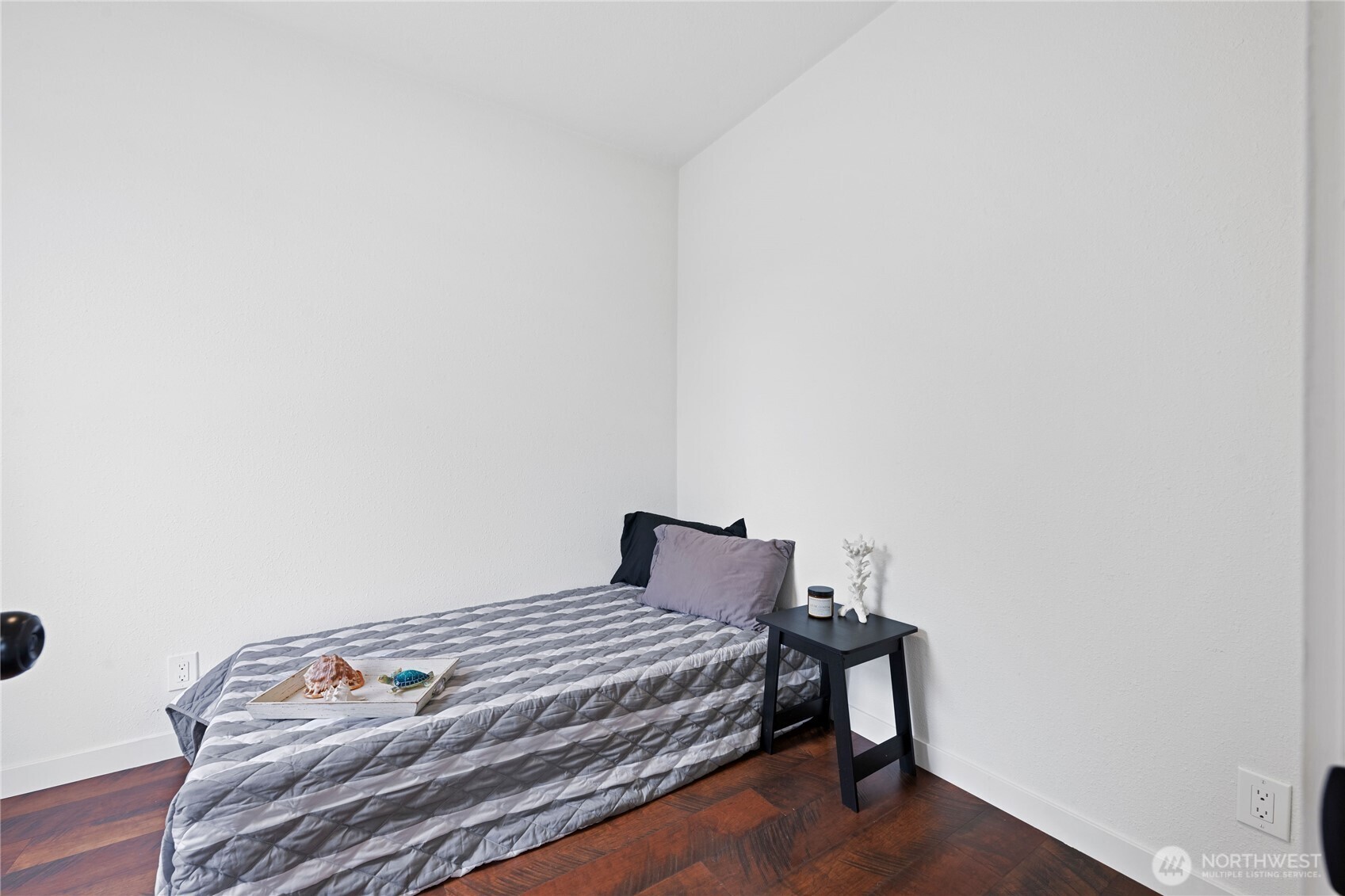 26502 Ridge Avenue Ocean Park, WA 98640 - Photo 7 of 30 a bedroom with a bed and wooden floor