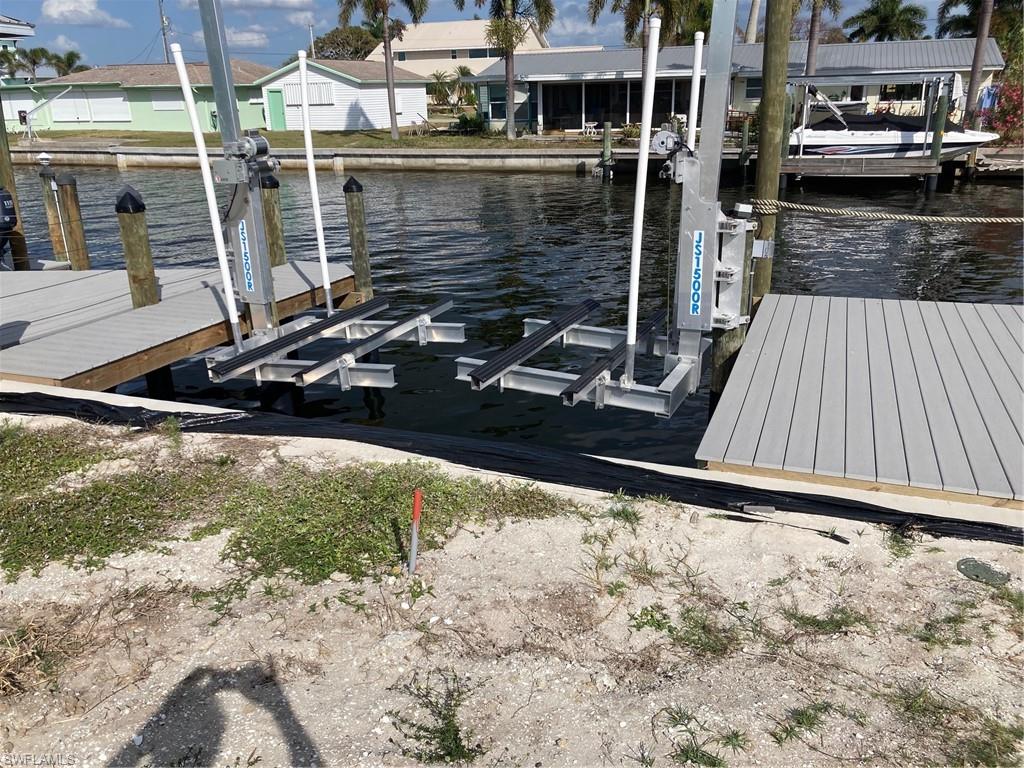 2849 Triggerfish Street Matlacha, FL 33993 - Photo 10 of 12 a view of a house with a yard