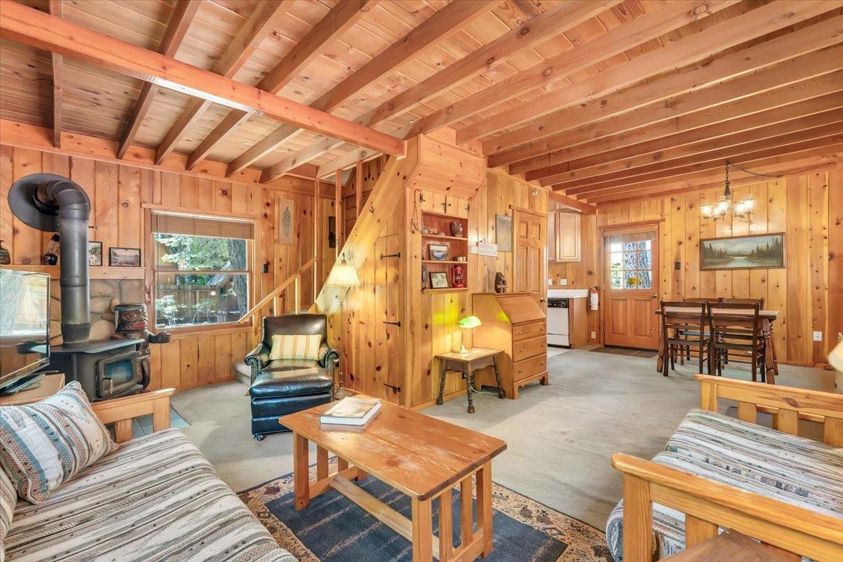 7230 3rd Avenue Tahoma, CA 96142 - Photo 4 of 20 a living room with furniture and a chandelier