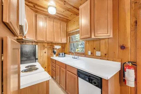 a kitchen that has a cabinets and a stove