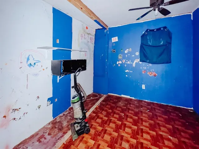 a bedroom with a bed and a mirror