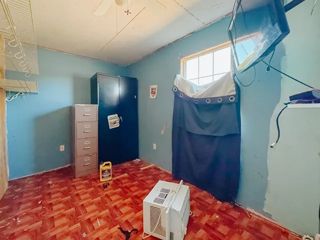 a bedroom with a closet and a cabinet